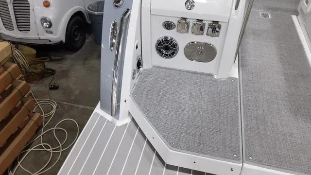 Slide: The Image of 2022 Formula 380 Super Sport Crossover boat deck with control panel and speaker. - 19