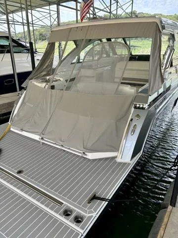 Slide: The Image of 2022 Formula 380 Super Sport Crossover docked with covered rear deck. - 20
