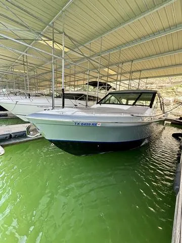 Slide: The Image of 2022 Formula 380 Super Sport Crossover docked in a covered marina. - 22