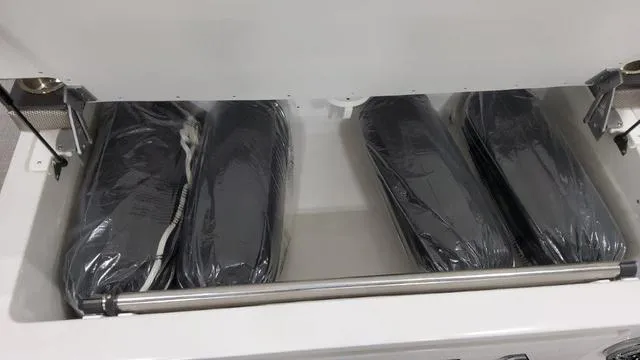 Slide: The Image of Storage compartment of 2022 Formula 380 Super Sport Crossover with black cushions. - 28