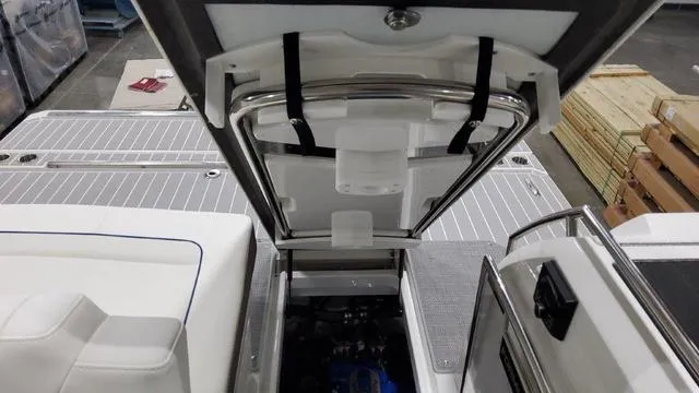 Slide: The Image of 2022 Formula 380 Super Sport Crossover boat interior with open engine compartment. - 29