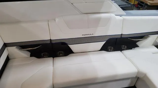 Slide: The Image of 2022 Formula 380 Super Sport Crossover white leather seating area with cup holders. - 40