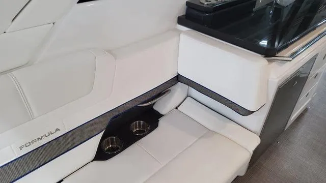 Slide: The Image of Interior seating of 2022 Formula 380 Super Sport Crossover with cup holders. - 42