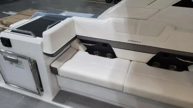 Slide: The Image of 2022 Formula 380 Super Sport Crossover boat interior with white seating. - 43