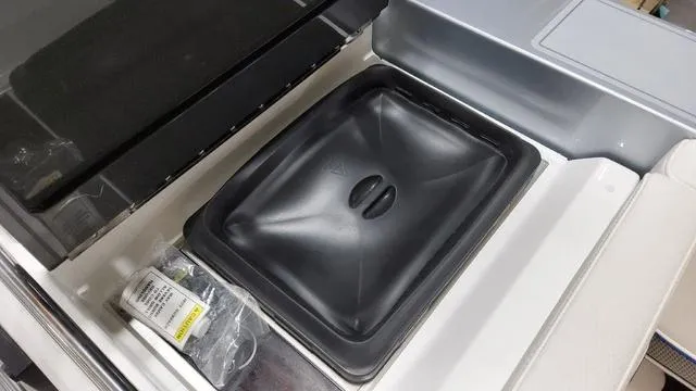 Slide: The Image of 2022 Formula 380 Super Sport Crossover storage compartment with black cover and accessories. - 44