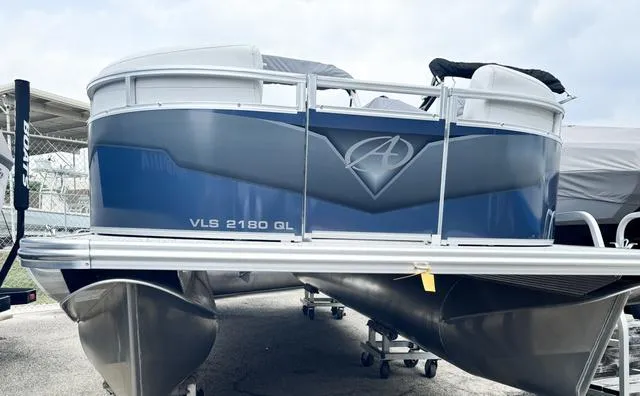Slide: The Image of 2024 Avalon VLS 21 Quad Lounger pontoon boat in blue and silver. - 10
