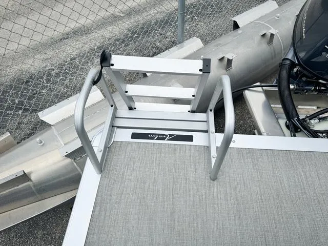 Slide: The Image of 2024 Avalon VLS 21 Quad Lounger boat ladder and deck detail. - 8