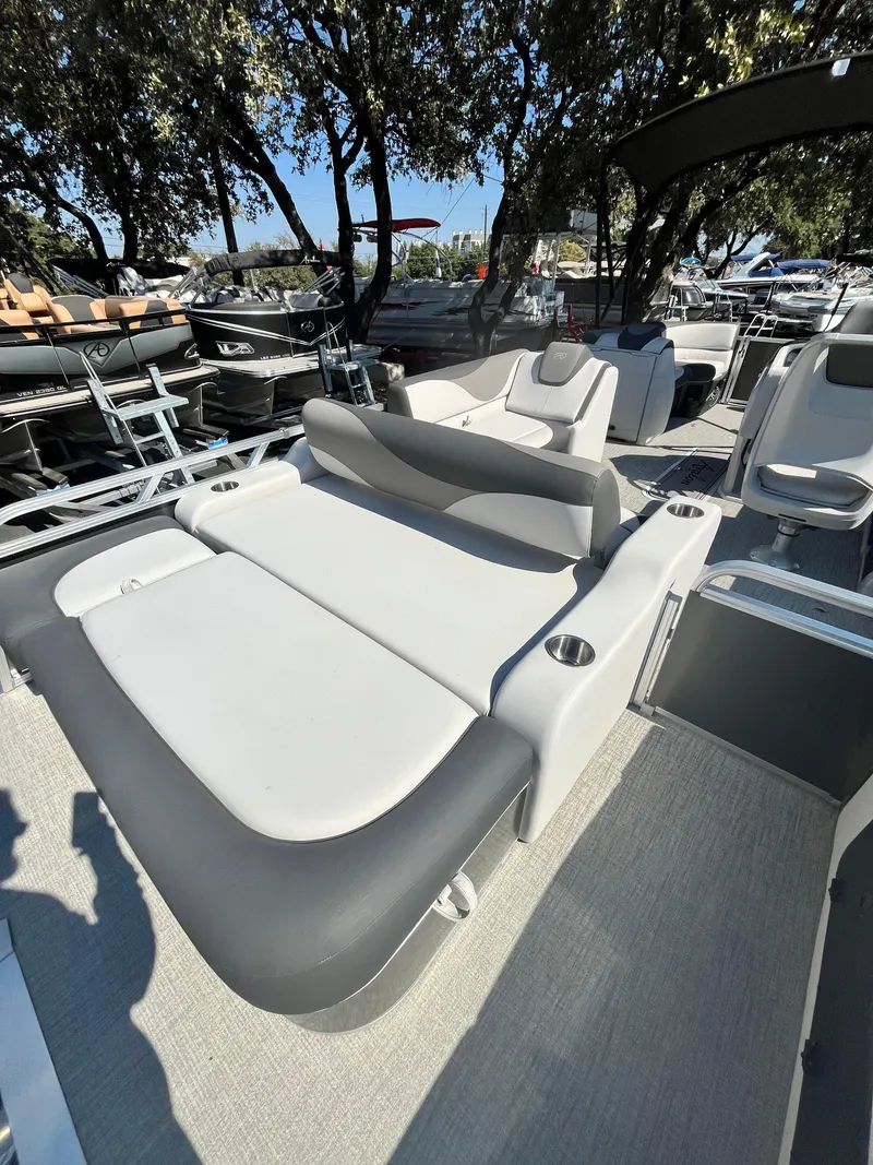 Slide: The Image of 2024 Avalon LSZ Versatile Rear Bench boat with sleek seating design. - 11