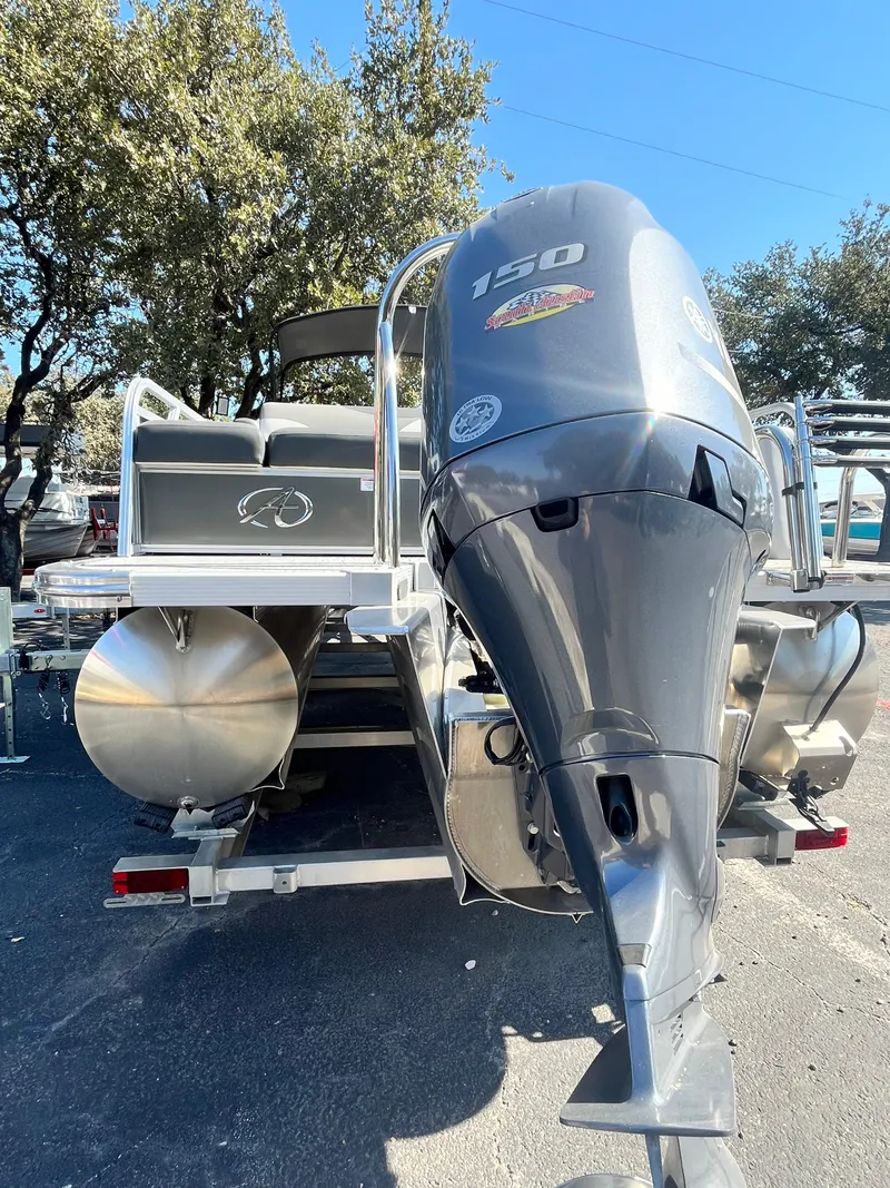 Slide: The Image of 2024 Avalon LSZ Versatile Rear Bench pontoon boat with powerful 150 HP engine. - 13