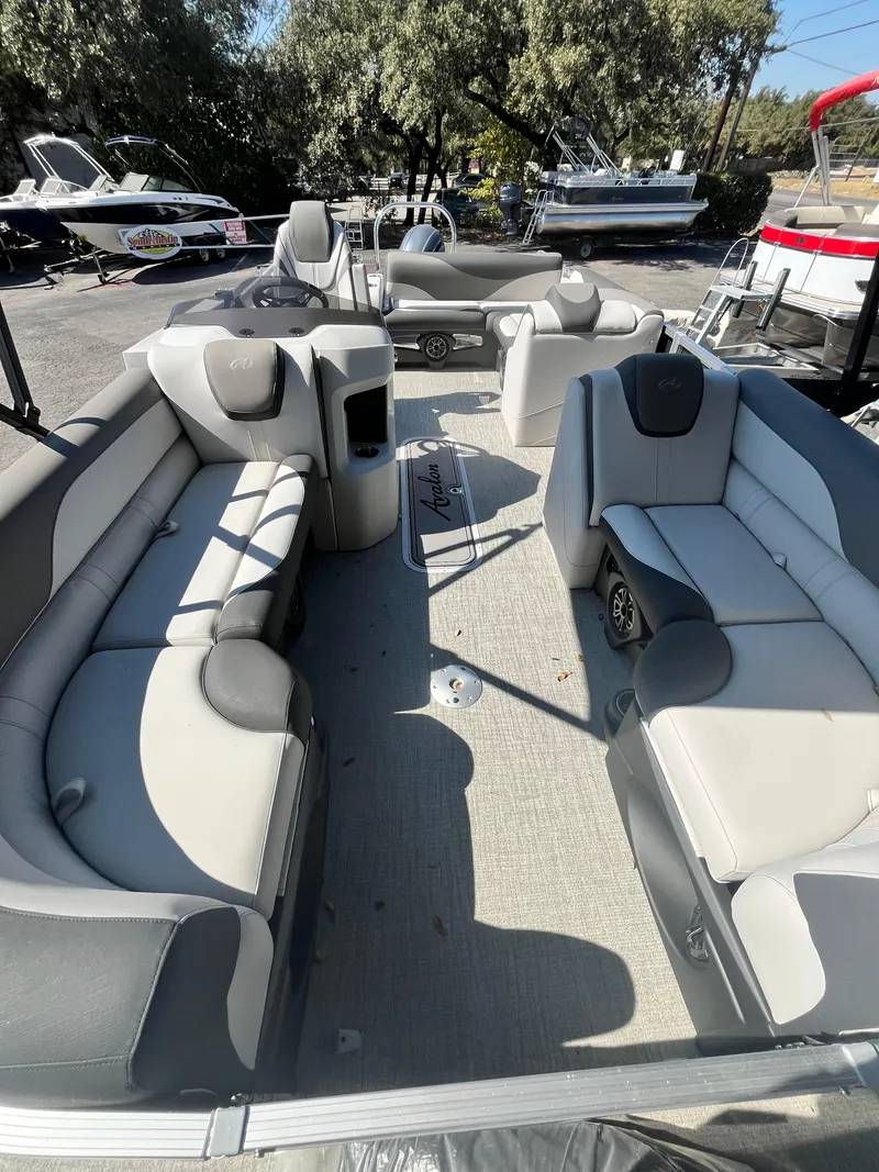 Slide: The Image of 2024 Avalon LSZ Versatile Rear Bench pontoon boat with spacious seating and modern design. - 15