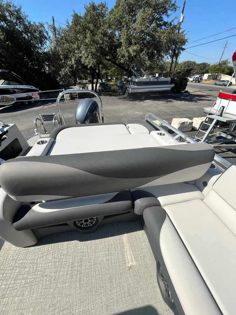 Slide: The Image of 2024 Avalon LSZ Versatile Rear Bench boat with sleek seating design. - 17