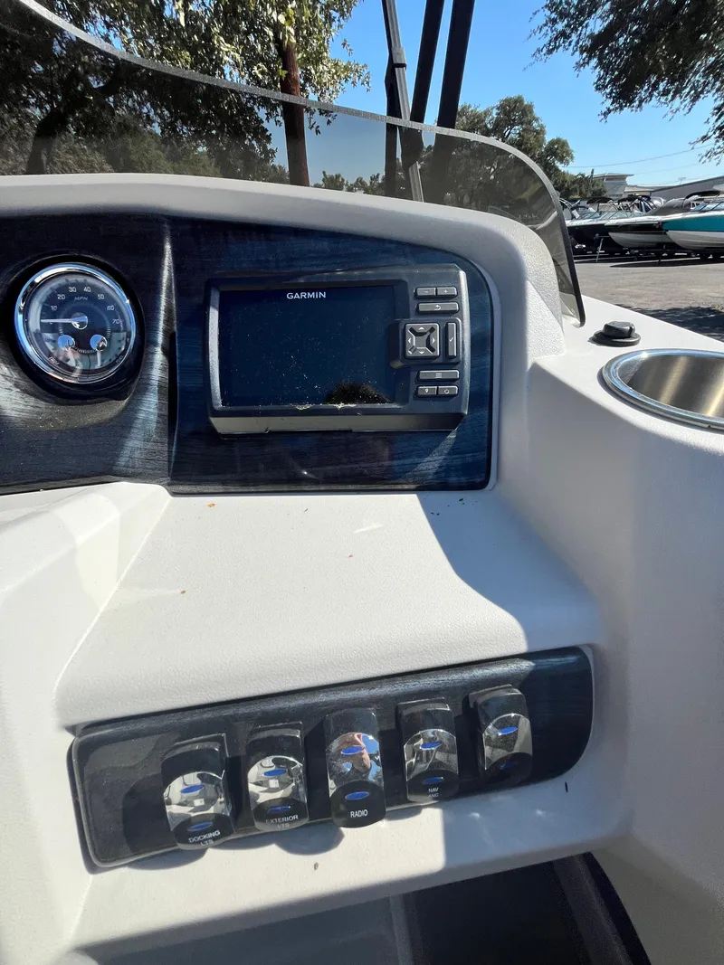 Slide: The Image of 2024 Avalon LSZ Versatile Rear Bench dashboard with controls and Garmin display. - 4