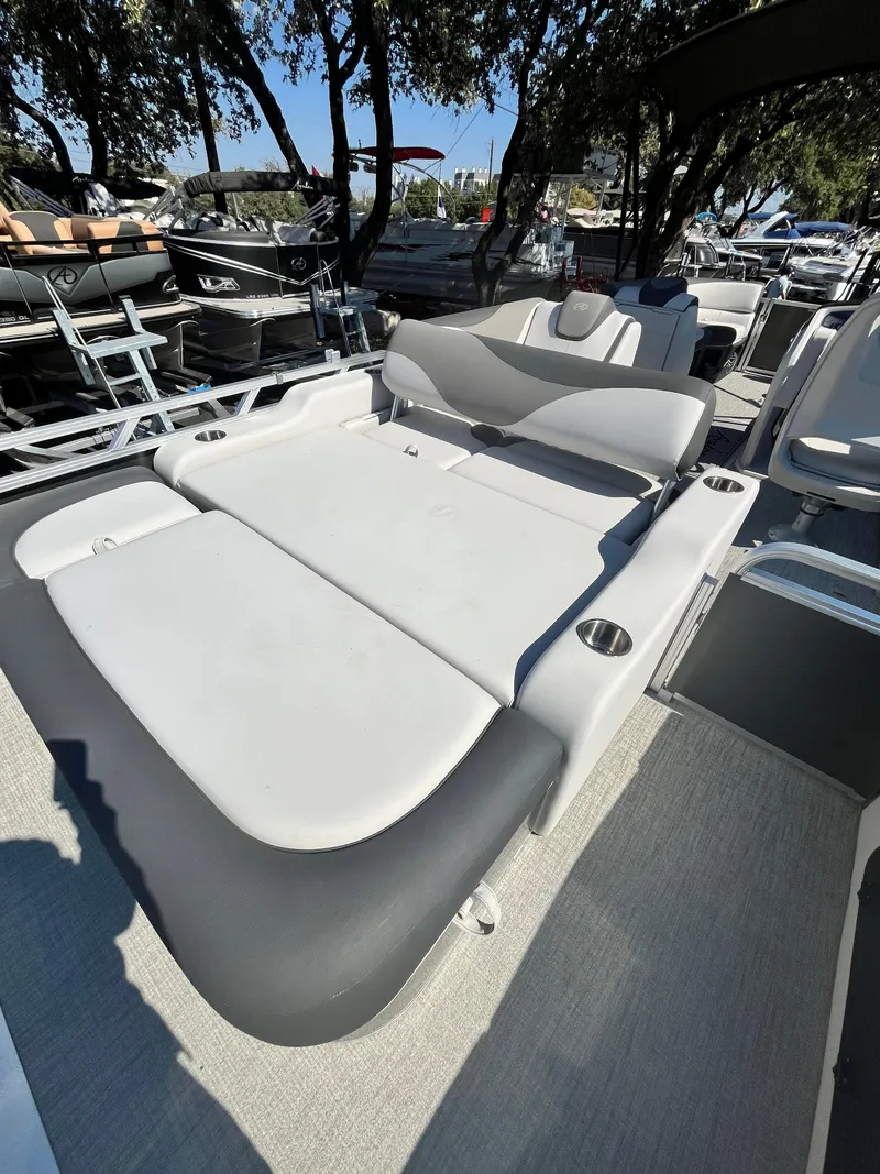 Slide: The Image of 2024 Avalon LSZ Versatile Rear Bench boat with sleek seating design. - 9
