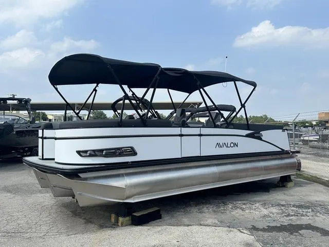 The Image of 2024 Avalon Catalina 25' Quad Lounger pontoon boat with black canopy. - 1