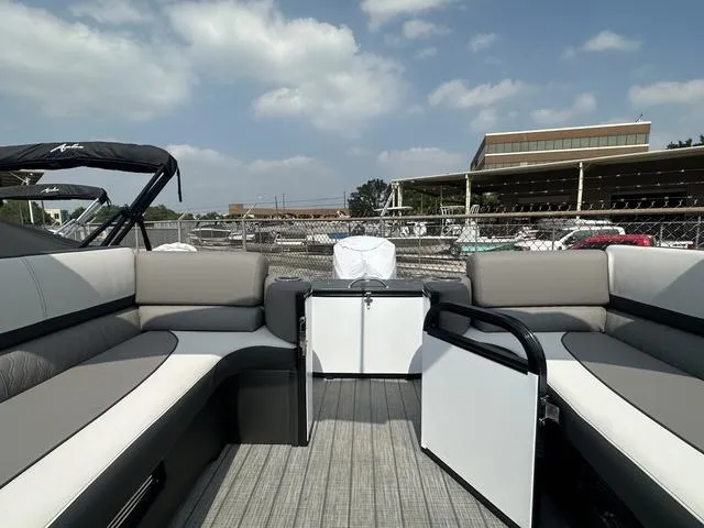 Slide: The Image of 2024 Avalon Catalina 25' Quad Lounger boat interior with gray and white seating. - 12