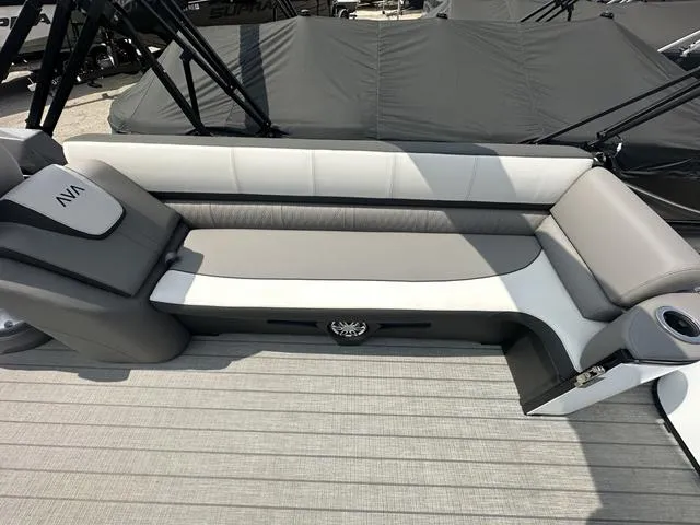 Slide: The Image of 2024 Avalon Catalina 25' Quad Lounger boat interior with gray and white seating. - 14