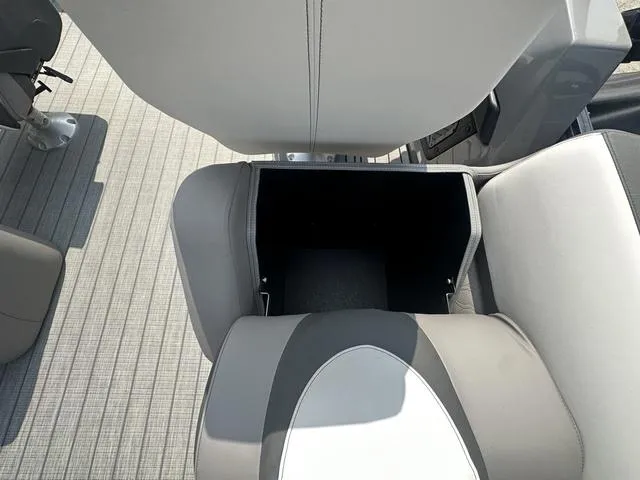 Slide: The Image of Open storage compartment in Avalon Catalina 25' Quad Lounger 2024 boat. - 17