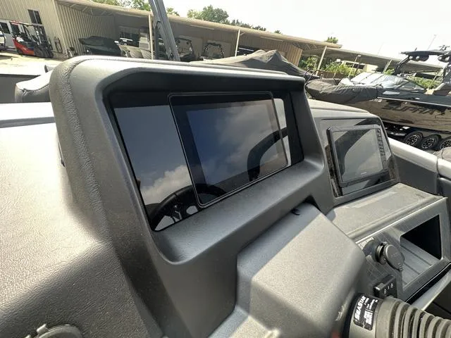 Slide: The Image of Dashboard of 2024 Avalon Catalina 25' Quad Lounger boat with modern controls. - 27