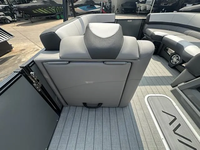 Slide: The Image of 2024 Avalon Catalina 25' Quad Lounger interior with gray seating and flooring. - 33