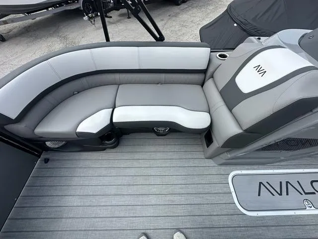 Slide: The Image of 2024 Avalon Catalina 25' Quad Lounger interior seating area with gray and white upholstery. - 39