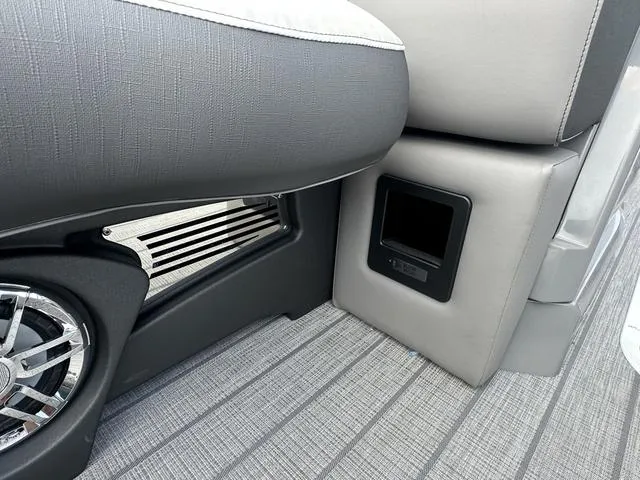 Slide: The Image of 2024 Avalon Catalina 25' Quad Lounger interior seating and speaker detail. - 42