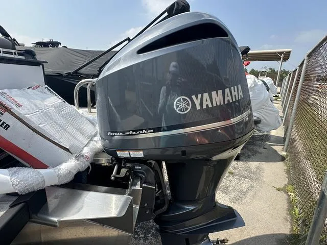 Slide: The Image of Yamaha four-stroke outboard motor on a 2024 Avalon Catalina 25' Quad Lounger boat. - 45