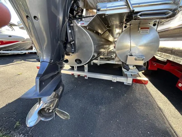 Slide: The Image of 2015 Bennington 2275 RCW pontoon boat on trailer, close-up of outboard motor and pontoons. - 16