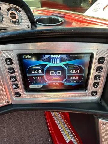 Slide: The Image of 2016 MasterCraft X30 boat dashboard with digital display showing engine and water temperature. - 15
