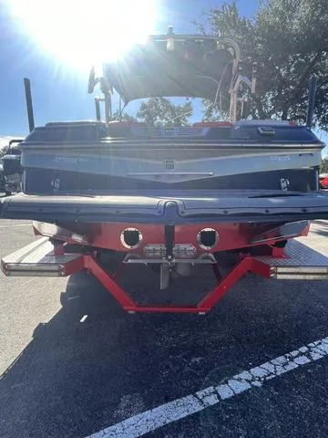 Slide: The Image of 2016 MasterCraft X30 boat rear view in parking lot. - 7