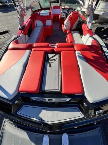 Slide: The Image of 2016 MasterCraft X30 boat with red and gray interior. - 9
