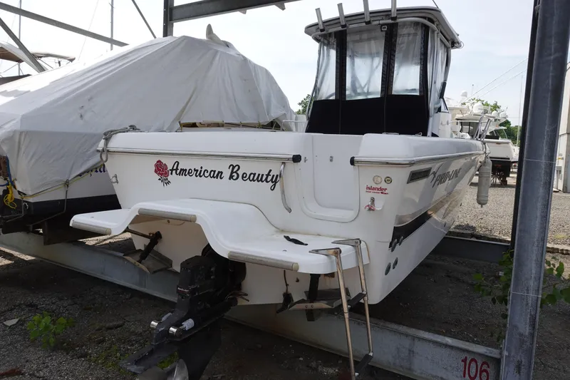 Slide: The Image of 2000 Pro-Line 24 Walk boat named "American Beauty" in storage. - 3