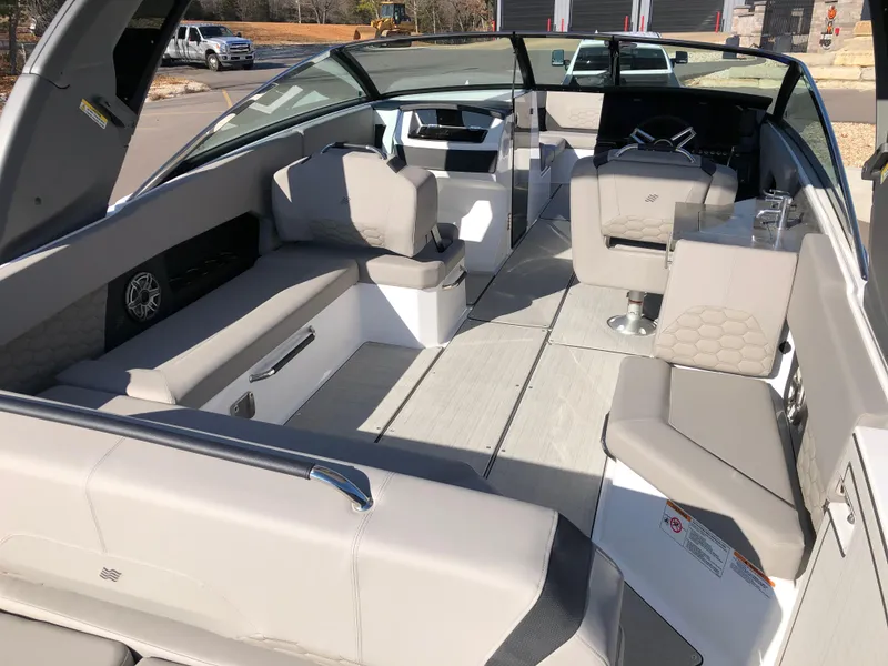 Slide: The Image of Interior of 2025 Four Winns H9 boat with spacious seating and modern design. - 12