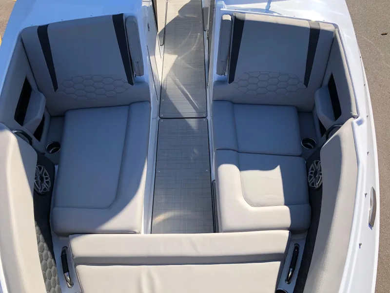 Slide: The Image of 2025 Four Winns H9 boat interior with spacious seating and modern design. - 19
