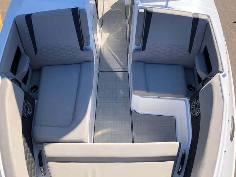 Slide: The Image of 2025 Four Winns H9 boat interior with spacious seating and modern design. - 21