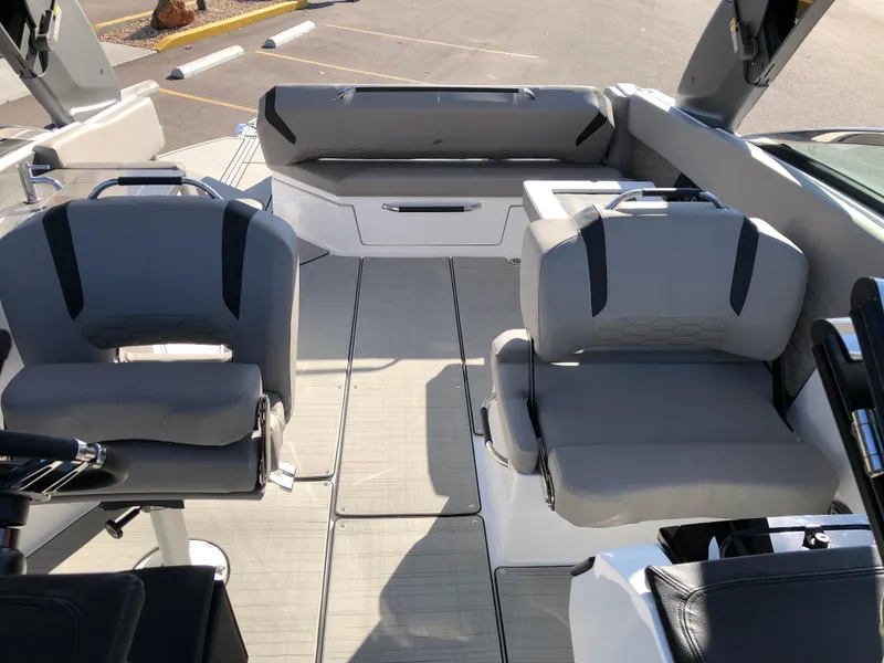 Slide: The Image of 2025 Four Winns H9 boat interior with modern seating and sleek design. - 22