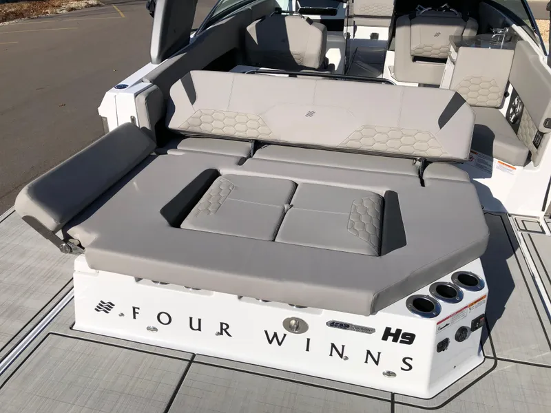 Slide: The Image of 2025 Four Winns H9 boat with spacious seating and modern design. - 28