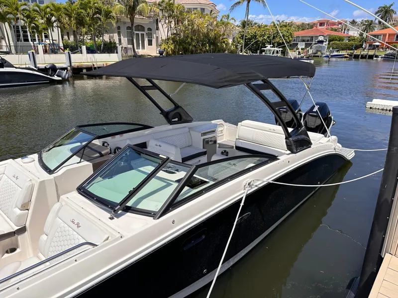 The Image of 2021 Sea Ray SDX 290 Outboard boat docked in a marina. - 0