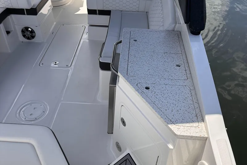Slide: The Image of 2021 Sea Ray SDX 290 Outboard boat interior with seating and storage compartments. - 13