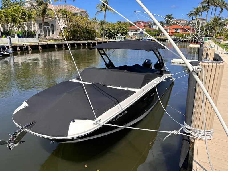 Slide: The Image of 2021 Sea Ray SDX 290 Outboard boat docked in a sunny canal. - 18
