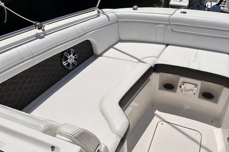 Slide: The Image of 2021 Sea Ray SDX 290 Outboard boat interior with white cushioned seating. - 5