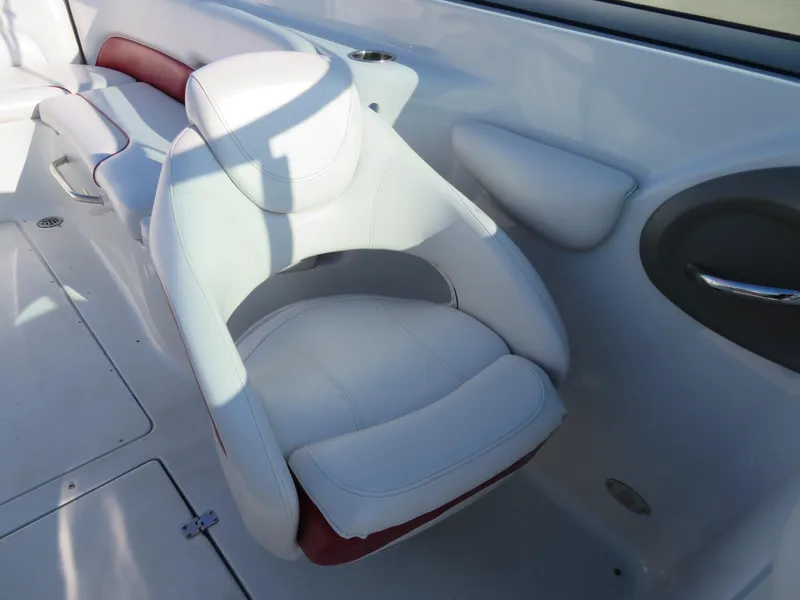 Slide: The Image of 2012 Crownline 275 SS boat interior with white and red seating. - 15