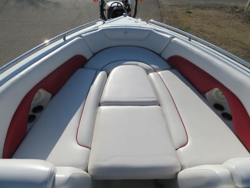 Slide: The Image of 2012 Crownline 275 SS boat with white and red cushioned seating. - 18