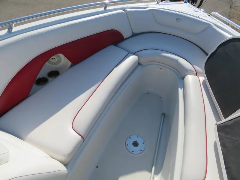 Slide: The Image of 2012 Crownline 275 SS boat interior with white and red seating. - 19