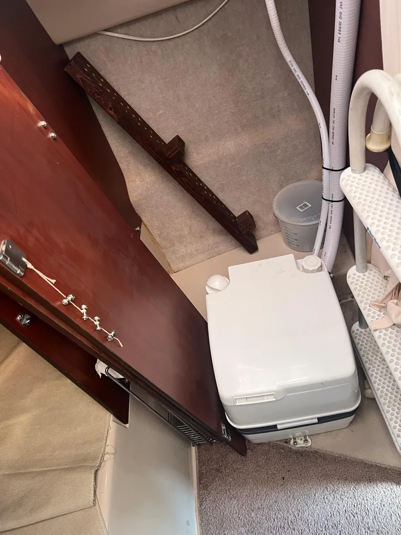 Slide: The Image of Compact bathroom in 2010 MacGregor 26M sailboat with portable toilet. - 6