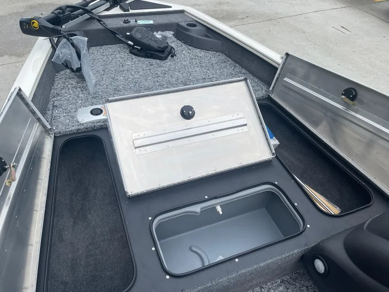 Slide: The Image of 2024 Tracker PT175 boat interior with open storage compartments. - 12