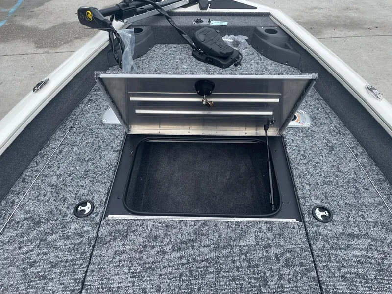 Slide: The Image of 2024 Tracker PT175 boat with open storage compartment. - 13
