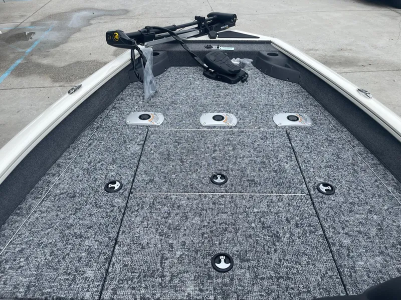 Slide: The Image of 2024 Tracker PT175 boat deck with storage compartments and trolling motor. - 14