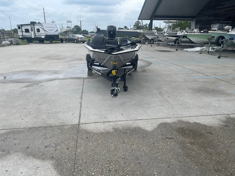 Slide: The Image of 2024 Tracker PT175 boat on a trailer in a dealership lot. - 3