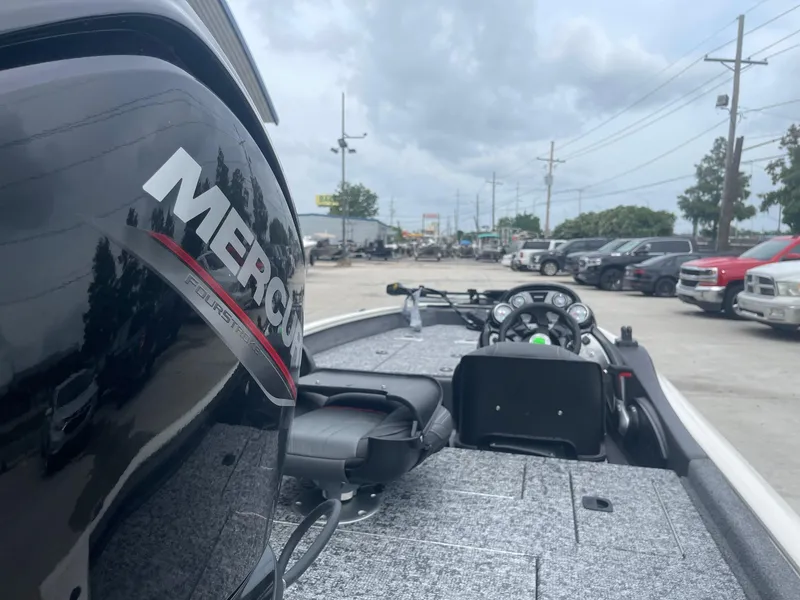Slide: The Image of 2024 Tracker PT175 boat with Mercury engine in a parking lot. - 8
