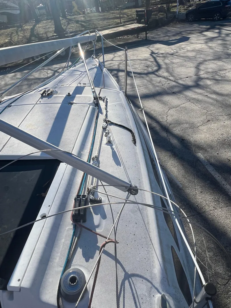Slide: The Image of 2002 Hunter 240 sailboat deck with rigging and lines. - 10
